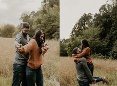 two people are hugging in the middle of a field with tall grass and trees behind them