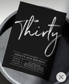 a black and white birthday party card with the word thirty printed in cursive font