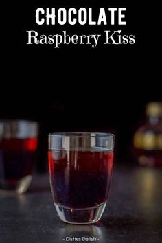 chocolate raspberry kiss in a glass on a table with the words, chocolate raspberry kiss