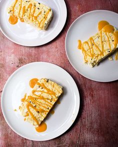 three white plates topped with slices of cake covered in caramel drizzles