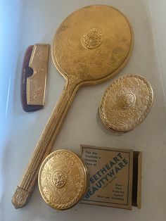 Vintage 1930s Filigree Hand Mirror and accessories. Sweetheart Beautyware. Given as Gifts at Movie Theaters in The 1930s. Never Used Gold and Glass are Good. Includes mirror, Small ring box, and compact still in it's original box. Very Rare Estate Find. 1930s Aesthetic, Tailor Shop, Gold Aesthetic, Gold Hands, Small Rings, Movie Theater