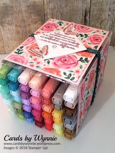 a box filled with lots of different colored crayons