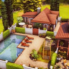 an aerial view of a house with a pool in the yard and landscaping around it