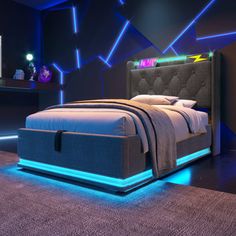 a bed with blue lights on the headboard and foot board, in a dark room