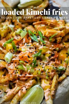 loaded kimchi fries with vegetables and seasoning on top, ready to be eaten