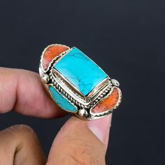 Turquoise Ring Red Coral Ring Size US 10 Inch Tibetan Silver Ring Handmade Jewelry Ring Tibetan Ethnic Tribal Ring Nepali Jewelry For Sister SKU :- PT-778 Statement Tibetan Rings Metal Purity :- Tibetan Silver Gemstone :- Turquoise, Coral Stone Color :- Green, Red Ring size :- US 10 Inch Weight :- 27 Gram ########## * They are handmade and designed carefully by craftsmen * Different gemstones and brass parts brought together to create an elegant piece * These are pieces to treasure that are sure Bohemian Turquoise Open Ring With Natural Stones, Adjustable Turquoise Bohemian Crystal Ring, Bohemian Open Ring Turquoise Gemstone, Bohemian Turquoise Rings With Stone Setting, Bohemian Turquoise Ring For Festival, Bohemian Turquoise Crystal Ring For Gift, Turquoise Bohemian Ring For Festival, Bohemian Turquoise Open Ring With Gemstone, Bohemian Turquoise Crystal Ring Gift