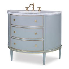 a bathroom vanity with two faucets on the top and one sink below it