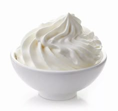 a white bowl filled with whipped cream