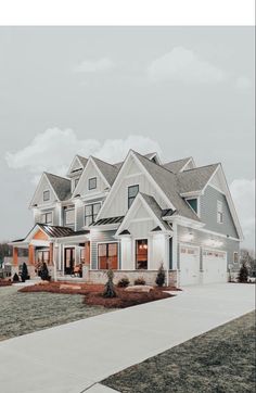 a large white and blue house with lots of windows