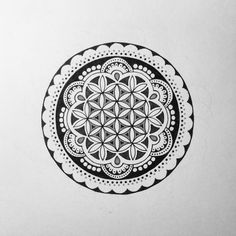 a black and white drawing of a flower of life