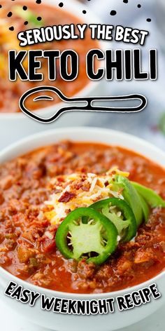 a white bowl filled with chili and topped with green peppers