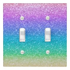 two light switch covers with multicolored glitter