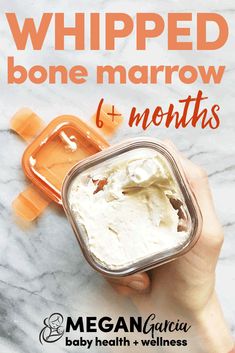 a hand holding a container of whipped bone marrow and 6 months baby health + wellness