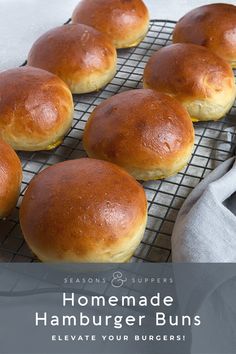 six buns on a cooling rack ready to go into the oven, with a cloth next to them