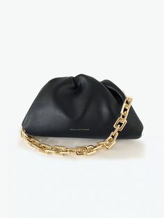 A classic day-to-night favorite from FREYA ESTEPHAN. Chain Pouch * Outer and inner lining made of 100% leather * Dimensions (Width, Depth, Height):    -Mini: 22 x 5.5 x 13 cm     -Medium: 31 x 7 x 18 cm   * Magnetic frame closure. Gold finish * Gold metal chain. Length 45cm. Removable NEW, with tags and box. Color: Black Black Clutch With Smooth Grain, Black Smooth Grain Clutch For Travel, Black Smooth Grain Clutch Bag, Elegant Soft Leather Black Pouch, Elegant Black Soft Leather Pouch, Black Smooth Grain Clutch, Magnetic Frame, Box Color, Leather Chain