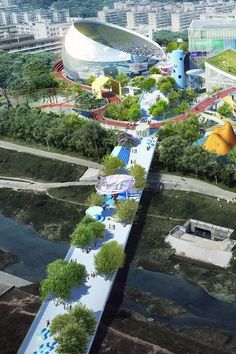 an aerial view of a park with trees and water