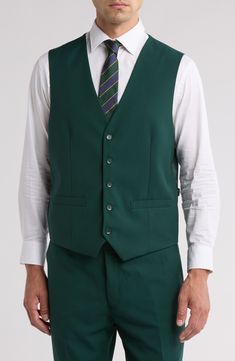 Bring understated elegance to the table in this three-piece suit crafted from rich fabric in a classic single-breasted silhouette. Jacket has notched lapels; chest welt pocket; front flap pockets Vest has front button closure; V-neck Pants have zip fly with button closure; front slant pockets; back button-welt pockets Jacket and vest are lined; trousers are lined to the knee 65% polyester, 35% viscose Dry clean Imported Each suit has a 6” drop, meaning that a size 38R jacket is paired with size Professional Single Breasted Three-piece Suit For Semi-formal Occasions, Classic Sleeveless Solid Outerwear, Elegant Green Three-piece Suit With Notch Lapel, Three-piece Suit With Button Closure For Formal Occasions, Semi-formal Three-piece Suit With Notch Lapel And Button Closure, Three-piece Suit With Button Closure For Work, Professional Three-piece Suit With Hidden Buttons, Green Fitted Three-piece Suit For Formal Occasions, Tailored Three-piece Suit With Hidden Buttons For Semi-formal