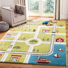 a child's rug with cars and trains on it in front of a window