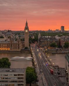 an aerial view of big ben and the river thames at sunset