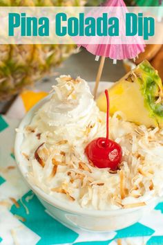 pineapple and coconut drink topped with whipped cream in a bowl