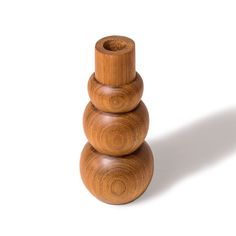 a stack of three wooden objects sitting on top of each other in front of a white background