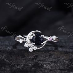 a ring with an oval blue stone surrounded by small white diamonds