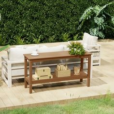 a wooden table sitting on top of a patio