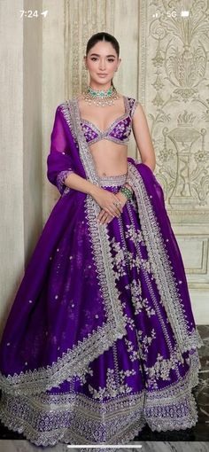 a woman in a purple lehenga