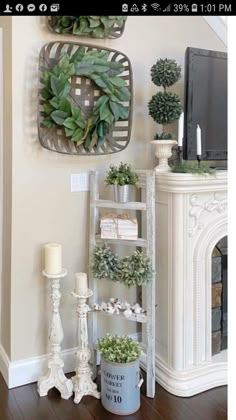 a living room filled with furniture and a tv on top of a fireplace mantel