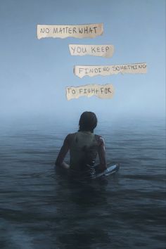 a person sitting in the water with some words written on them above their head,