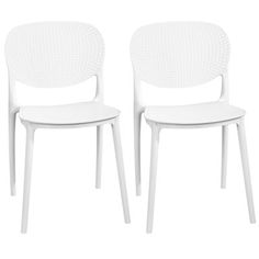 two white chairs sitting next to each other