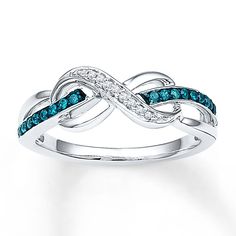 a white gold ring with blue and white diamonds