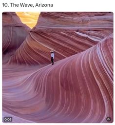 a person standing in the middle of a canyon with wavy rock formations behind them and text that reads, 10 the wave, arizona