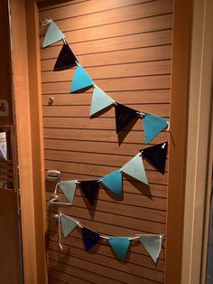 a door decorated with blue and black pennants