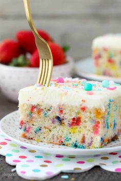 a slice of cake with sprinkles and a fork