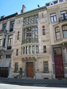 an old building with many windows and balconies