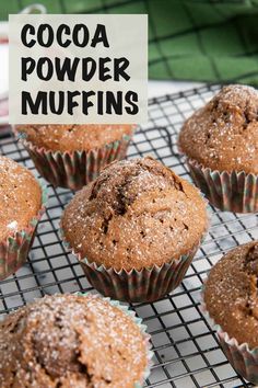 chocolate powdered muffins on a cooling rack with the words cocoa powdered muffins above them