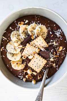 a bowl filled with chocolate and banana slices