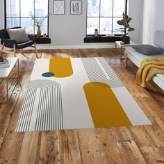 a modern living room with wood floors and white furniture, including a large rug on the floor