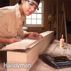 a woman working on a piece of wood