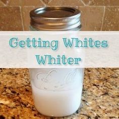 a mason jar filled with white liquid sitting on top of a counter