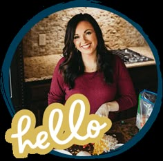 a woman standing in front of a table with food on it and the words hello written over her