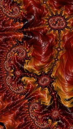 an abstract painting with red, yellow and orange colors in the center is spirals