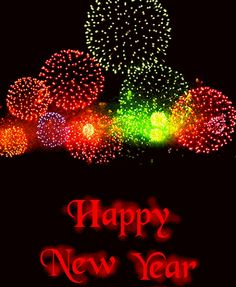 fireworks are lit up in the night sky with happy new year written on it's side