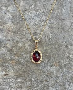 This necklace is handcrafted with an authentic 6x8mm garnet stone in a gold setting. The chain is 14k gold-filled and will not tarnish easily.  This necklace is hypoallergenic. (Cadium free, lead free, and nickel safe) Garnet is an energizing stone that promotes passion and love.  The necklace comes in a ribbon-wrapped box, ready to be gifted. If you would like to leave a note for the recipient, you can do so during checkout. Gender Crisis, Garnet Necklace Gold, Maroon Necklace, Garnet And Gold, Crystal Necklaces, Garnet Pendant, Garnet Necklace, Dope Jewelry, Vintage Style Jewellery