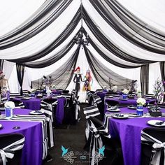 the tables are decorated with black and white linens