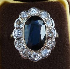 Date made: 1930's Sapphire content: 6ct Diamond content: 1.20ct Metal: 18ct white gold Condition: Excellent commensurate to it's age Finger length: 21mm Ring Size: UK S1/2   US/CAN 93/8  can be resized A stunning original art deco ring  This ring is simply breathtakingly beautiful. Catching the viewers eye is a wonderful 6ct oval cut sapphire. Measuring 13mmx9mm this has a mesmerising royal blue colour which has a rich depth too its colour, outstanding Flowing around the sapphire are twelve old Diamond Knot Ring, Edwardian Necklace, Antique Rings Vintage, Antique Jewellery Online, Gold Solitaire Ring, Three Stone Diamond, Antique Ring, Sapphire Diamond Ring, Deco Ring