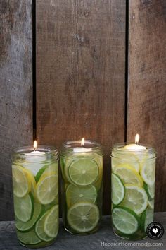 three mason jars filled with lemon and lime slices