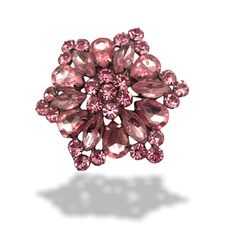 Take a look at this wonderful 1950s pink starburst or flower brooch with loads of BLING!  There are two shades of pink rhinestones in various sizes and cuts, prong set into a pristine silvertone base. The layered form gives the pin a slight dome shape, all the crystals  have a lovely vivacity, ultra feminine look and romantic jewel to show off with any style of dress, from morning to night, to be glittering with what little of sophisticated, which is good!   It's cm.6 (2-3/8 in.)  from side to s Vintage Rose Brooch, Rose Broche, Luxury Flower-shaped Brooch For Formal Occasions, Elegant Pink Flower Brooch, Pink Starburst, Gold Flower-shaped Brooch With Rhinestones, Ultra Feminine, Beautiful Costumes, Feminine Design