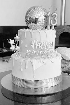 a birthday cake with a disco ball on top and happy 13th birthday written on it